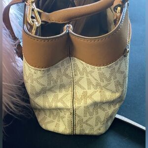 Gently used small Michael Kors crossbody. No makeup, no pens, no scratches